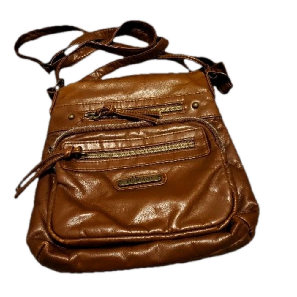 Stone & CO smoking mountain bucket cross body in the color Cognac